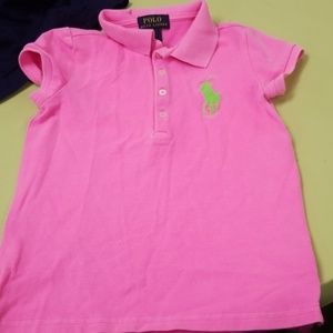 Bright pink polo with a green pony